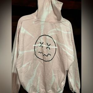 Pink tie dye hoodie with “smiley” face on the back/front